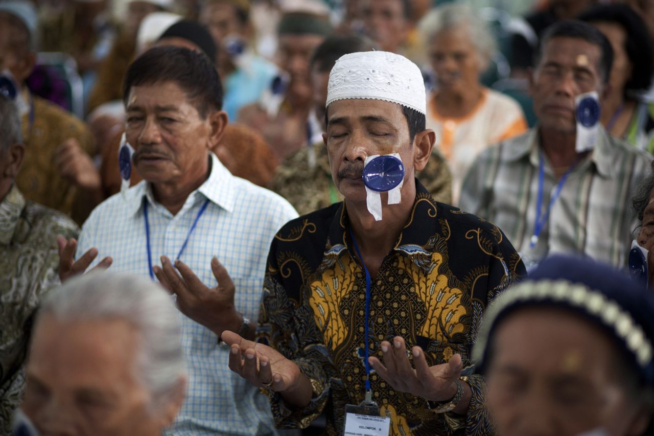 A recovering patient prays during a post operative examination session in Medan, Indonesia in 2011.