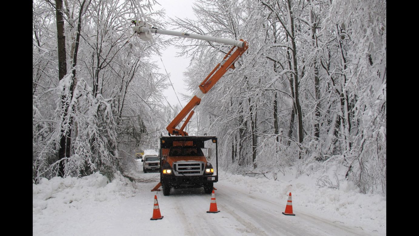Green Mountain Power cuts limbs overhanging power lines in Waterbury, Vermont, on December 11.