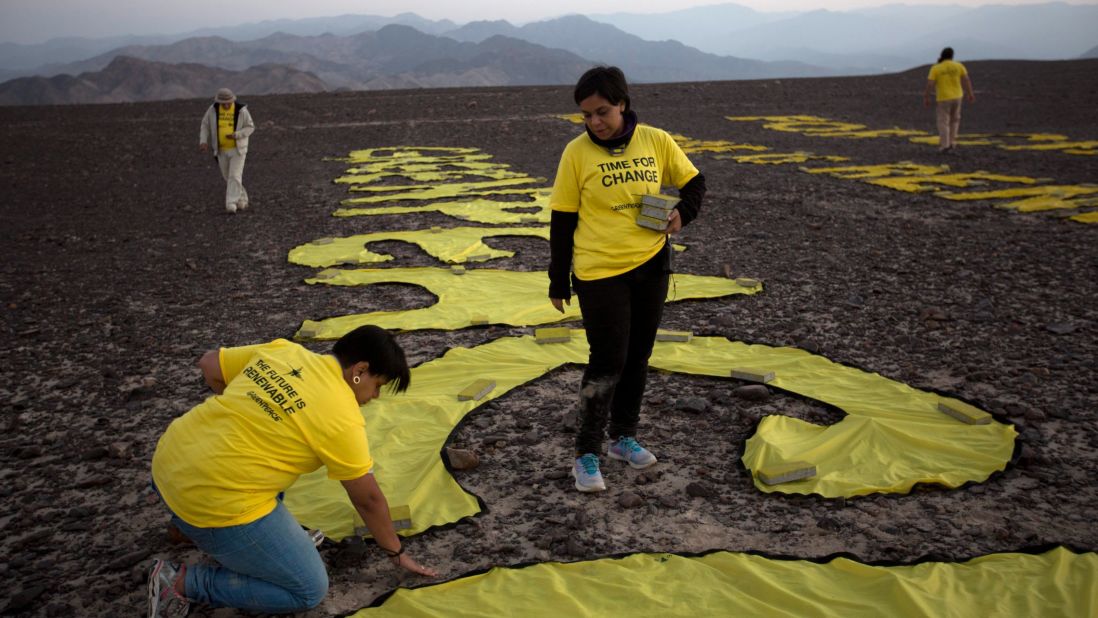 Greenpeace activists, who arranged the letters of their message next to a famous hummingbird geoglyph, timed their December 8 demonstration to a United Nations conference on climate change in Lima.
