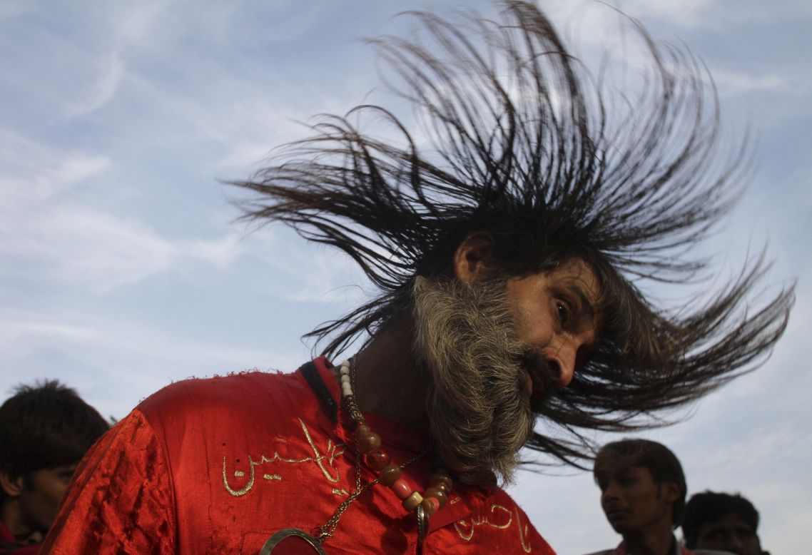 DECEMBER 12 - LAHORE, PAKISTAN: A Muslim devotee dances to celebrate the three-day annual congregation of famous saint Data Ganj Baksh at a shrine. Thousands of people traveled from all over the country to attend the celebrations. 