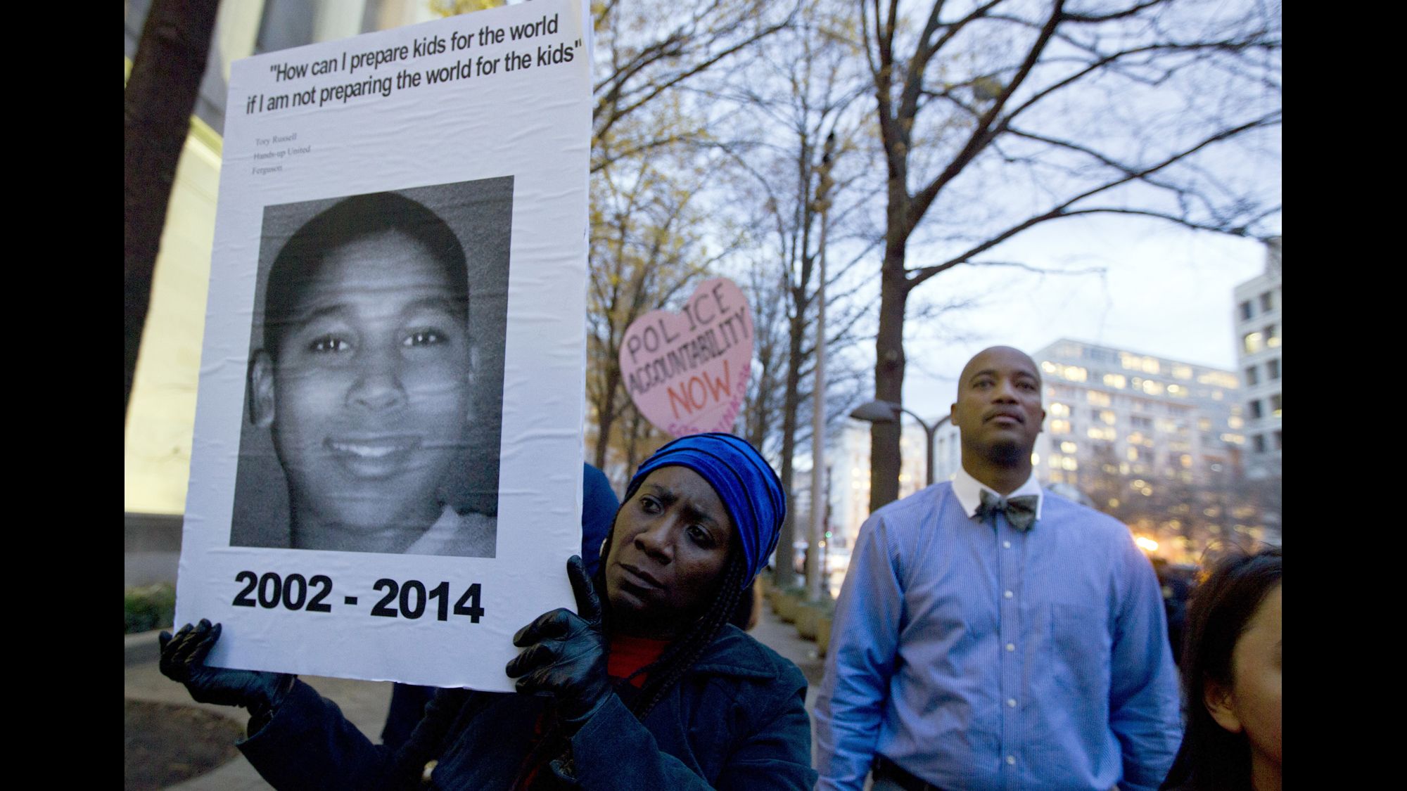 A demonstrator in Washington holds a picture of Tamir Rice on December 1 at a protest about a different case: last month's decision by a grand jury not to indict a police officer in the shooting death of Michael Brown in Ferguson, Missouri.