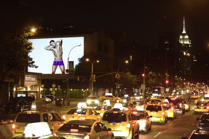 Cristiano Ronaldo shows off his briefs in the Bowery district of New York. Huge images of the Real Madrid star where projected in major cities for the launch of his CR7 underwear range in 2013.