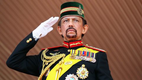 Brunei's Sultan Hassanal Bolkiah, one of the world's longest-reigning monarchs, salutes during a ceremonial guard of honor to mark his 68th birthday celebrations in Bandar Seri Begawan on August 14, 2014. 