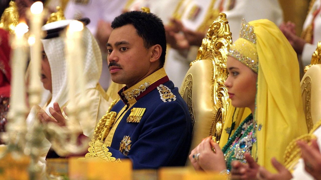 Brunei's Crown Prince Al-Muhtadee Billah Bolkiah and his new bride, Sarah, pray during their wedding banquet at the Nurul Iman Palace in Bandar Seri Begawan in September 2004. 