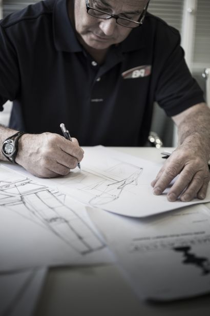 Dirk Kramers sketches some designs for Ben Ainslie Racing. He also uses an iPad.