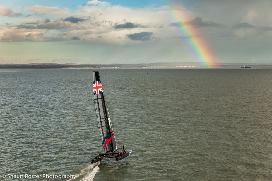 A rainbow in the distance greets the Ben Ainslie Racing team in mixed conditions in Portsmouth
