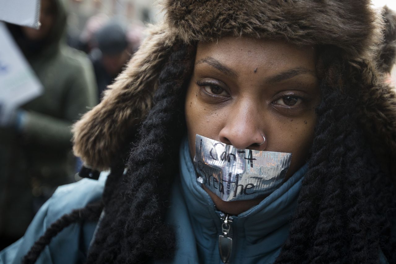 A demonstrator marches in New York on December 13 during the "Justice for All" rally.