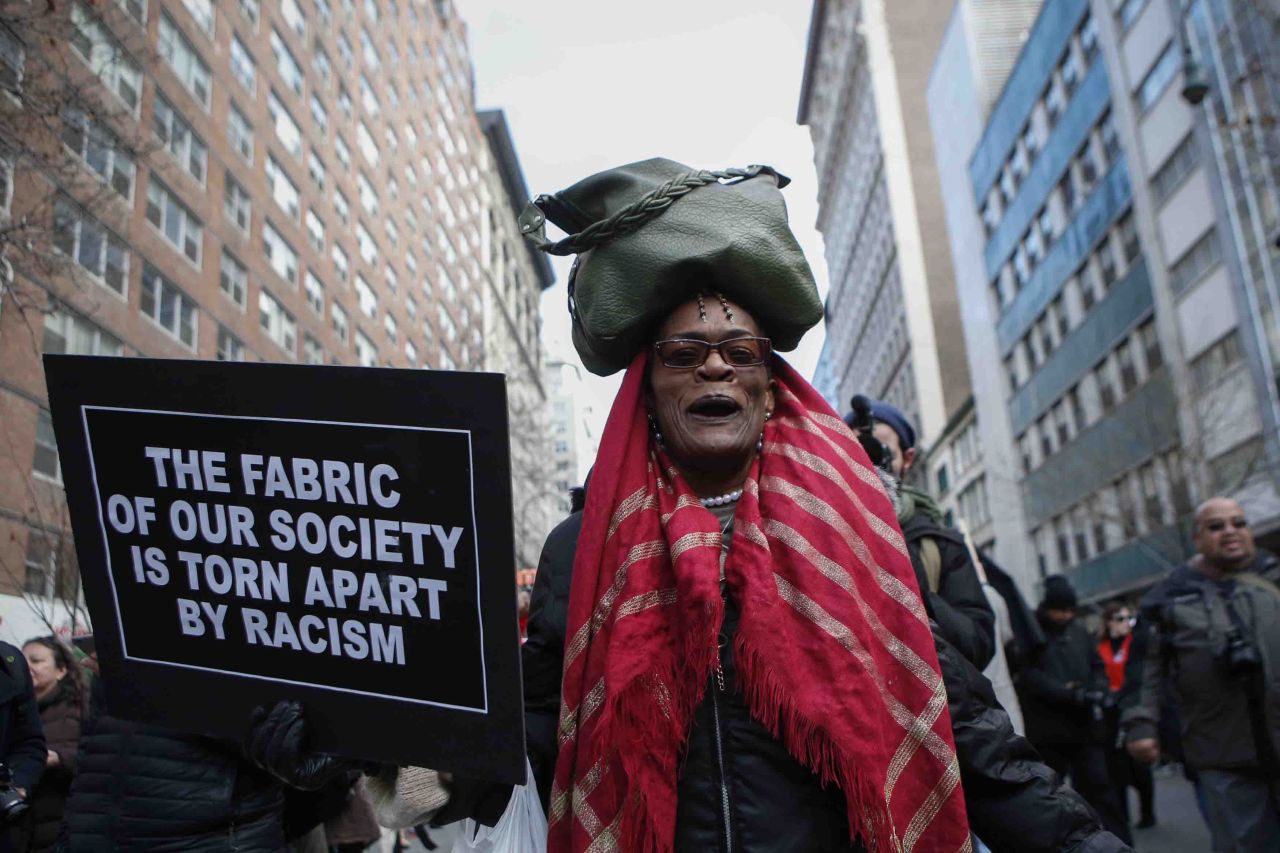 A woman marches down 14th Street in New York on December 13. 