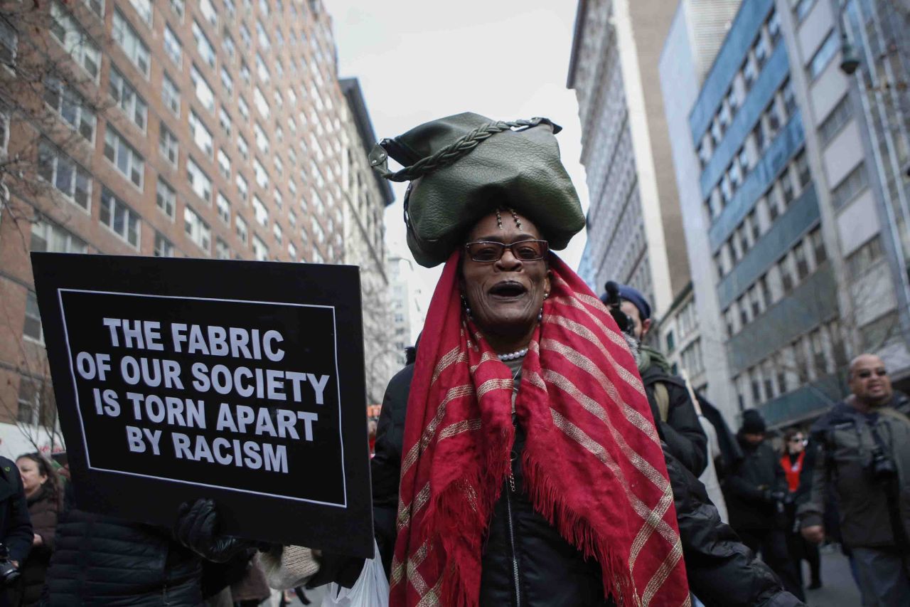 A woman marches down 14th Street in New York on December 13.