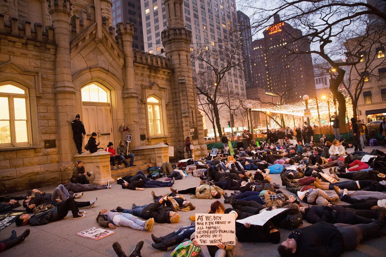 Protesters stage a "die-in" during a march in Chicago on December 13.