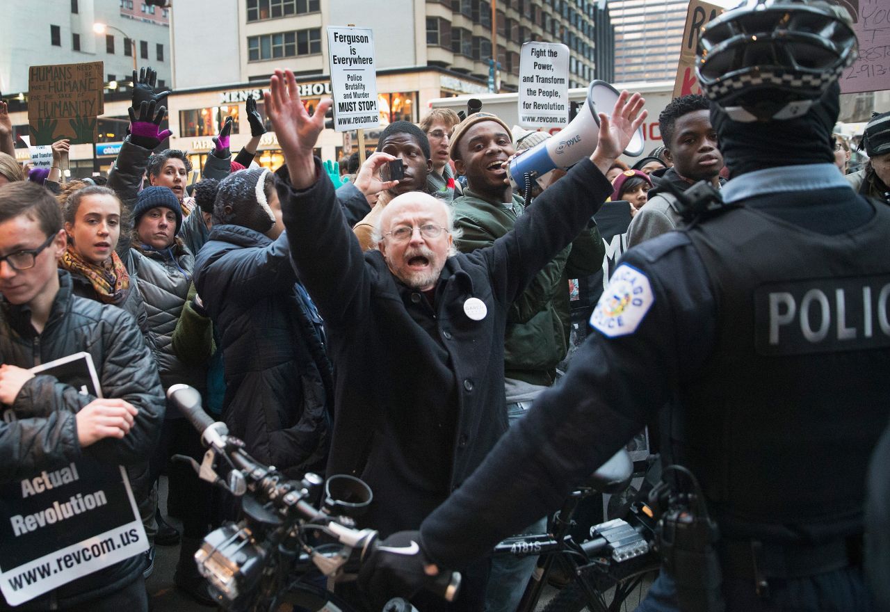 Demonstrators face off with police during a march in Chicago on December 13.