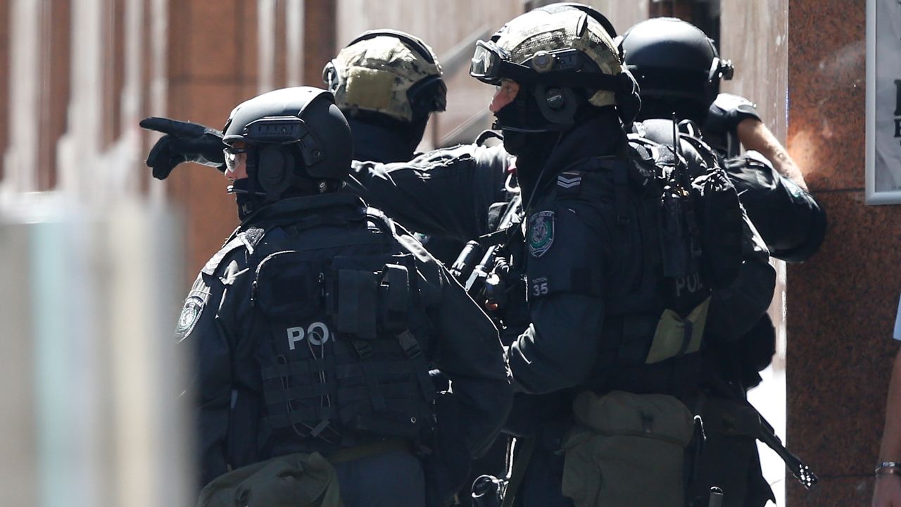  Police officers talk at the scene. 