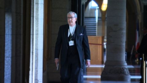 Kevin Vickers, sergeant-at-arms for Canada's House of Commons, is seen here with his gun drawn moments after gunning down an armed man who killed an army reservist and then stormed an Ottawa Parliament building in October. Vickers was hailed as a hero for his bravery, which may have saved many lives.