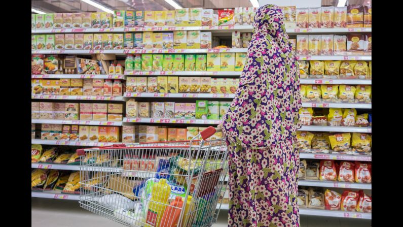 A woman shops at Hyperstar, an international-style supermarket in Shiraz, Iran. Photographer Thomas Cristofoletti visited the country earlier this year and noticed an increasing presence of Western-style consumerism.
