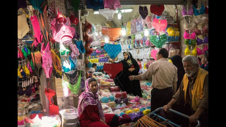 A woman shops at the Grand Bazaar of Tehran. "Even if traditional grand bazaars continue to be the favorite places to shop for regular Iranians, they now face competition from huge shopping malls," Cristofoletti said.