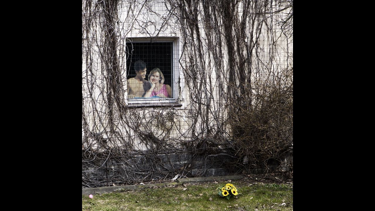 A paper cutout sits in the window of a home that's scheduled to be demolished for coal mining operations. It's one of Freeman's favorite photos: "It promoted this perfect couple and a perfect world, when it really wasn't perfect."