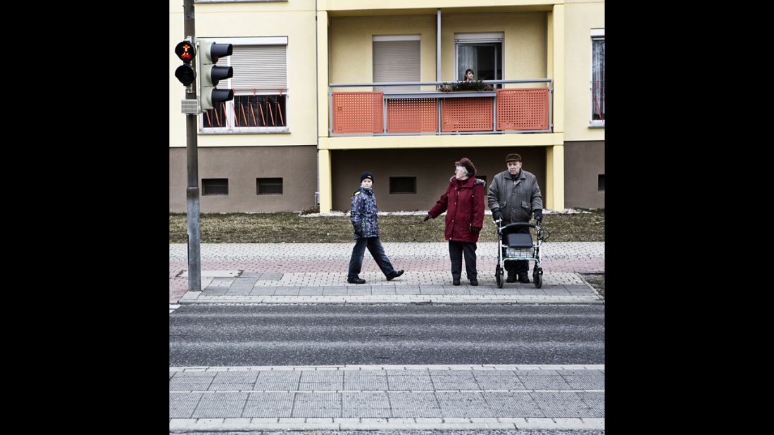 A couple and their grandson wait to cross the street. Hoyerswerda's average age is 48, Freeman said, and it continues to climb while the 20-30 age group has dropped dramatically.