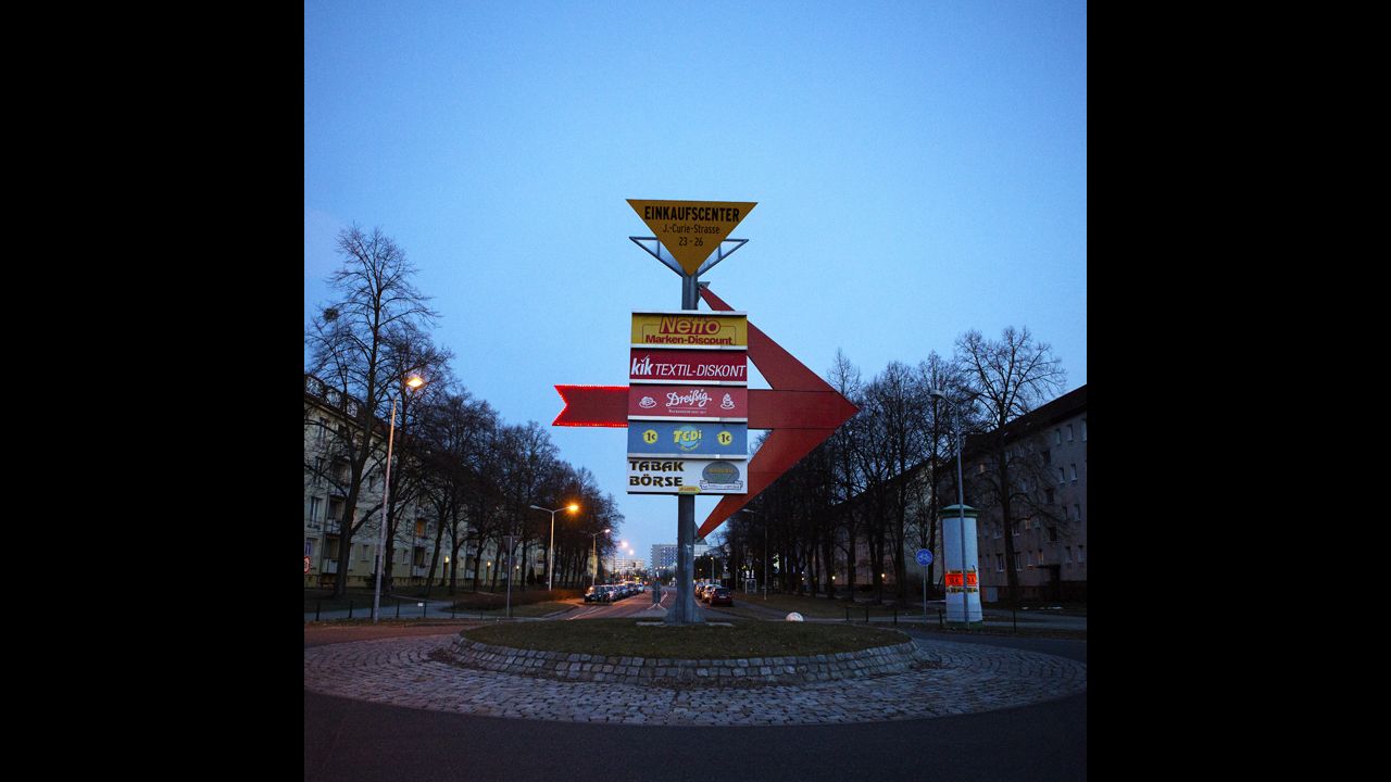 A shopping center sign stands in the roundabout in the New Town area of Hoyerswerda. This area was added to accommodate the increase of residences in the early 1970s.