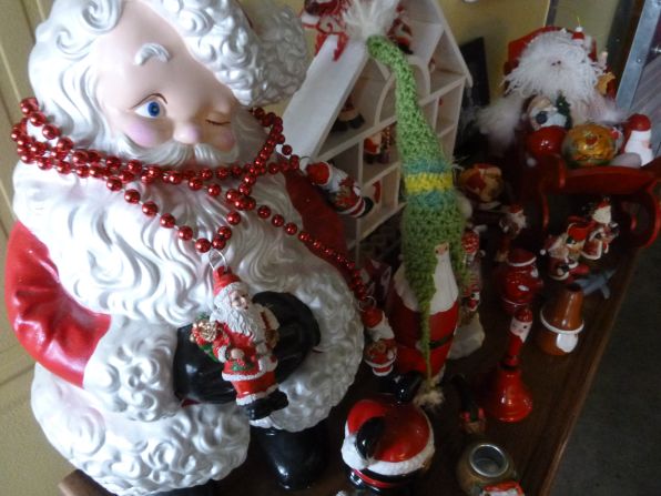 It takes about six hours for <a href="http://ireport.cnn.com/docs/DOC-1196101">Megan Venable</a> to clear off the bookshelves where she lovingly displays her inherited Santa collection in her Knoxville, Tennessee, loft each Christmas.