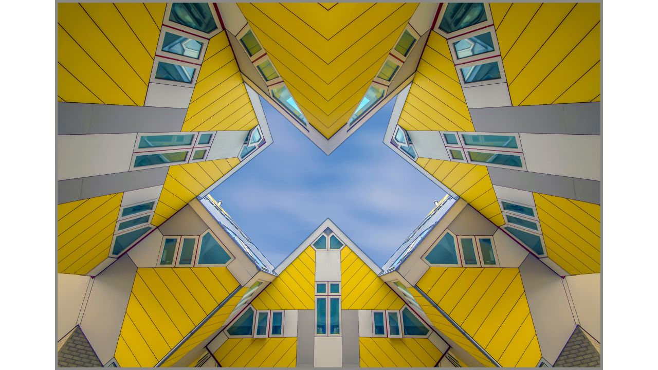 <strong>"Blaak," by Cor Boers</strong><br /><br />Cor Boers from the Netherlands photographed this shot of unusual angular buildings in his homeland. The Cube Houses, or Kubuswoningen, were designed by architect Piet Blom.<br /><br />"Blom tilted the cube of a conventional house 45 degrees, and rested it upon a hexagon-shaped pylon," says Boers. "His design represents a village within a city, where each house represents a tree and all the houses together, a forest."
