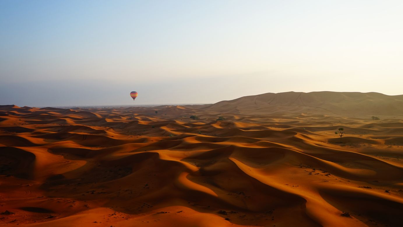 <strong>"Desert Dawn," by Gareth Lowndes</strong><br /><br />New Zealand's Gareth Lowndes took this image titled "Desert Dawn" in an undisclosed location.<br /><br />Lowndes says the image was shot about 20 minutes after sunrise. The balloon in the distance is about to begin its descent to land in a camel farm.