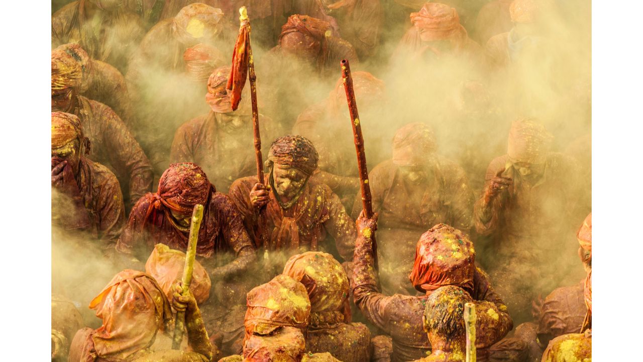 <strong>"Holi," by Ioulia Chvetsova</strong><br /><br />France's Ioulia Chvetsova took this photograph at the annual Lathmar Holi Festival in India. Here, Hindu holy men from the village of Nandgaon are covered in colored powder as they sing and pray.