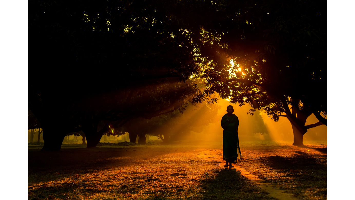 <strong>"Vigorous Touch of the Morning," by Jubair Bin Iqbal</strong><br /><br />Another early morning scene is captured by Bangladeshi photographer Jubair Bin Iqbal. Here, a Hindu monk walks in a mango garden in Dinajpur on a foggy winter morning.