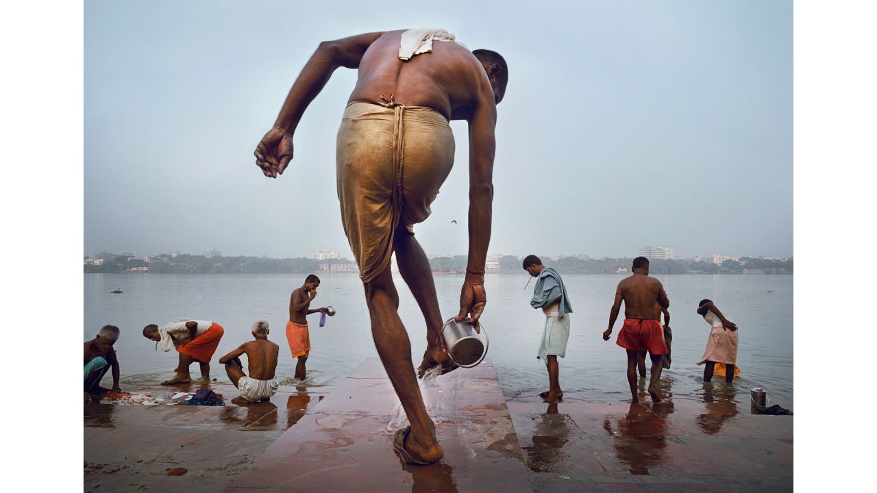 <strong>"The Morning Ritual," by Nick Ng</strong><br /><br />Malaysian photographer Nick Ng captures another moment of devotion with this image from India. Here a man readies himself for ablutions in the Hooghly River, part of the Ganges River, on an early morning in Kolkata.