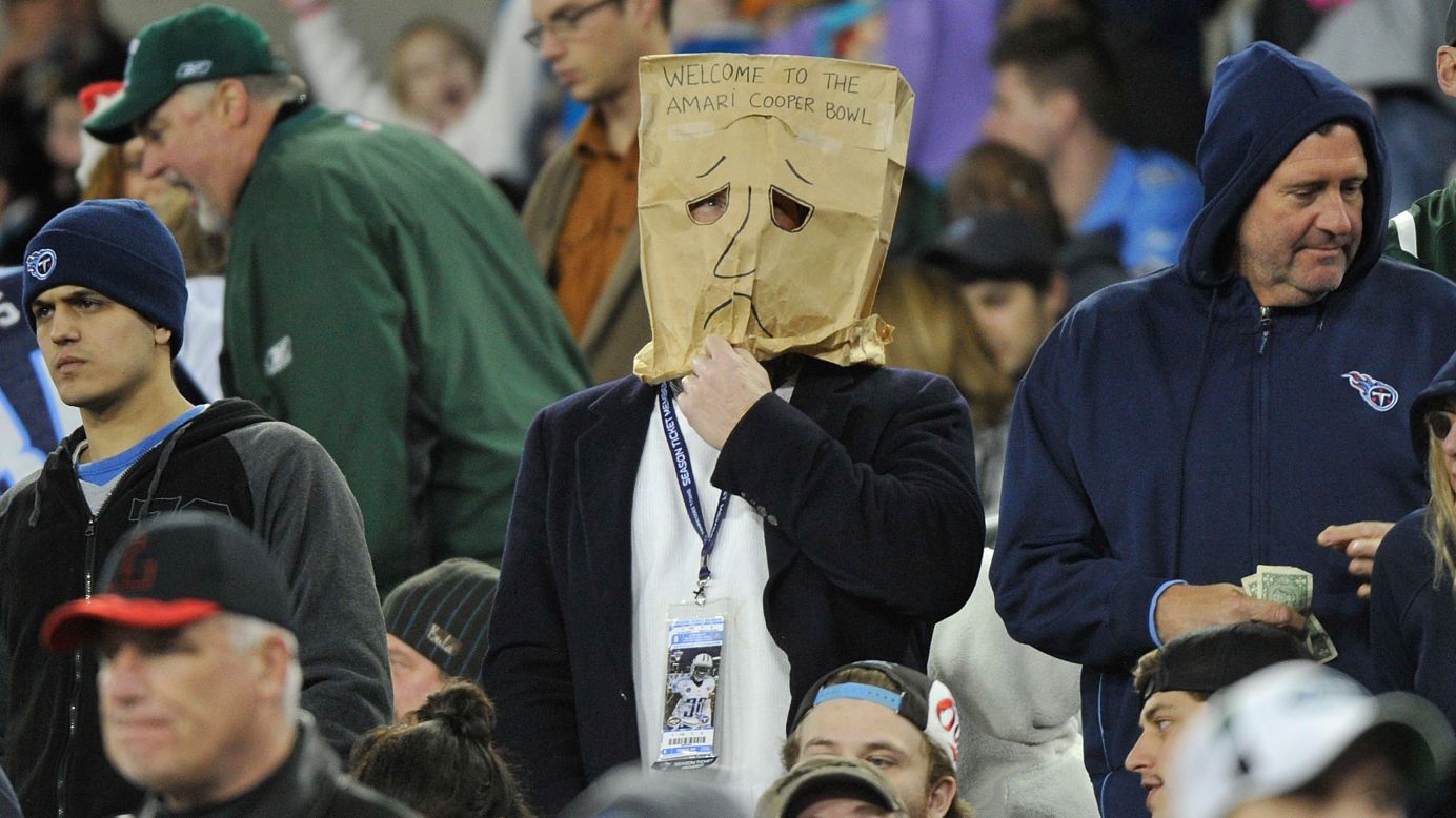 A Tennessee Titans fan wears a bag on his head during the NFL team's home game against the New York Jets on Sunday, December 14. Both teams entered the game with a 2-11 record. The Jets won 16-11.