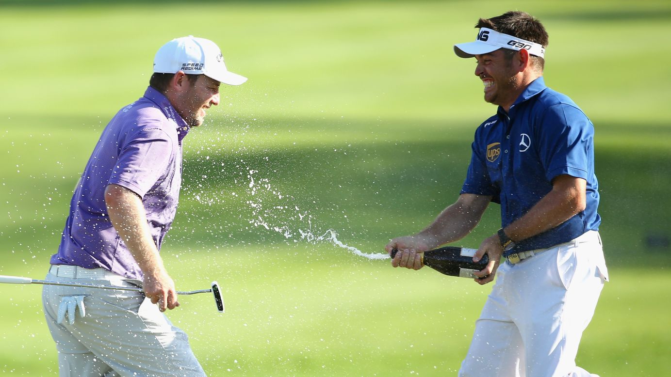 South African golfer Louis Oosthuizen sprays champagne on his countryman, Branden Grace, after Grace won the Alfred Dunhill Championship on Sunday, December 14. The European Tour event was played in Malalane, South Africa.
