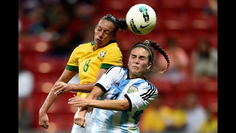 Brazil's Rosana, left, competes for a header with Argentina's Agustina Barroso during Brazil's 4-0 victory Wednesday, December 10. Brazil is hosting the International Tournament of Brasilia, a four-team tournament that also includes China and the United States.