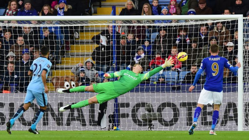 Manchester City goalkeeper Joe Hart dives to cover a free kick from Leicester City's Esteban Cambiasso during a Premier League match played Saturday, December 13, in Leicester, England. Manchester City, the defending league champions, won 1-0 behind a goal from Frank Lampard.