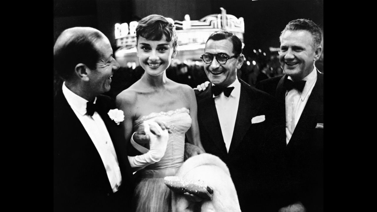 From left, Cole Porter, Audrey Hepburn, Irving Berlin and an unidentified man in the early 1950s.