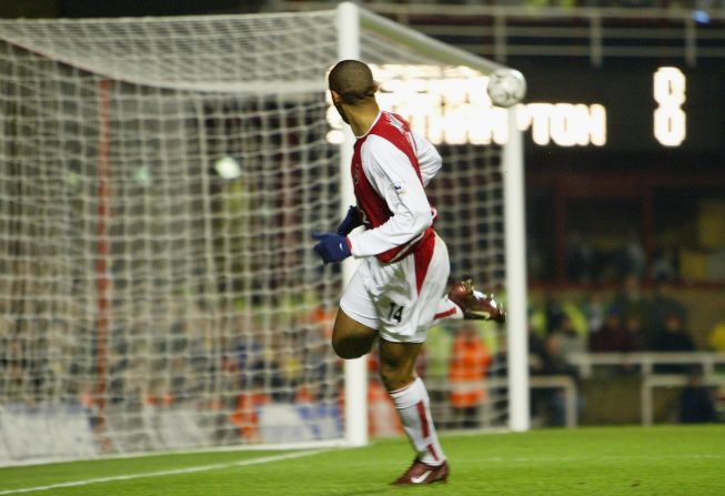 Henry wheels away after scoring his 100th Premier League goal for Arsenal against Southampton in 2004.