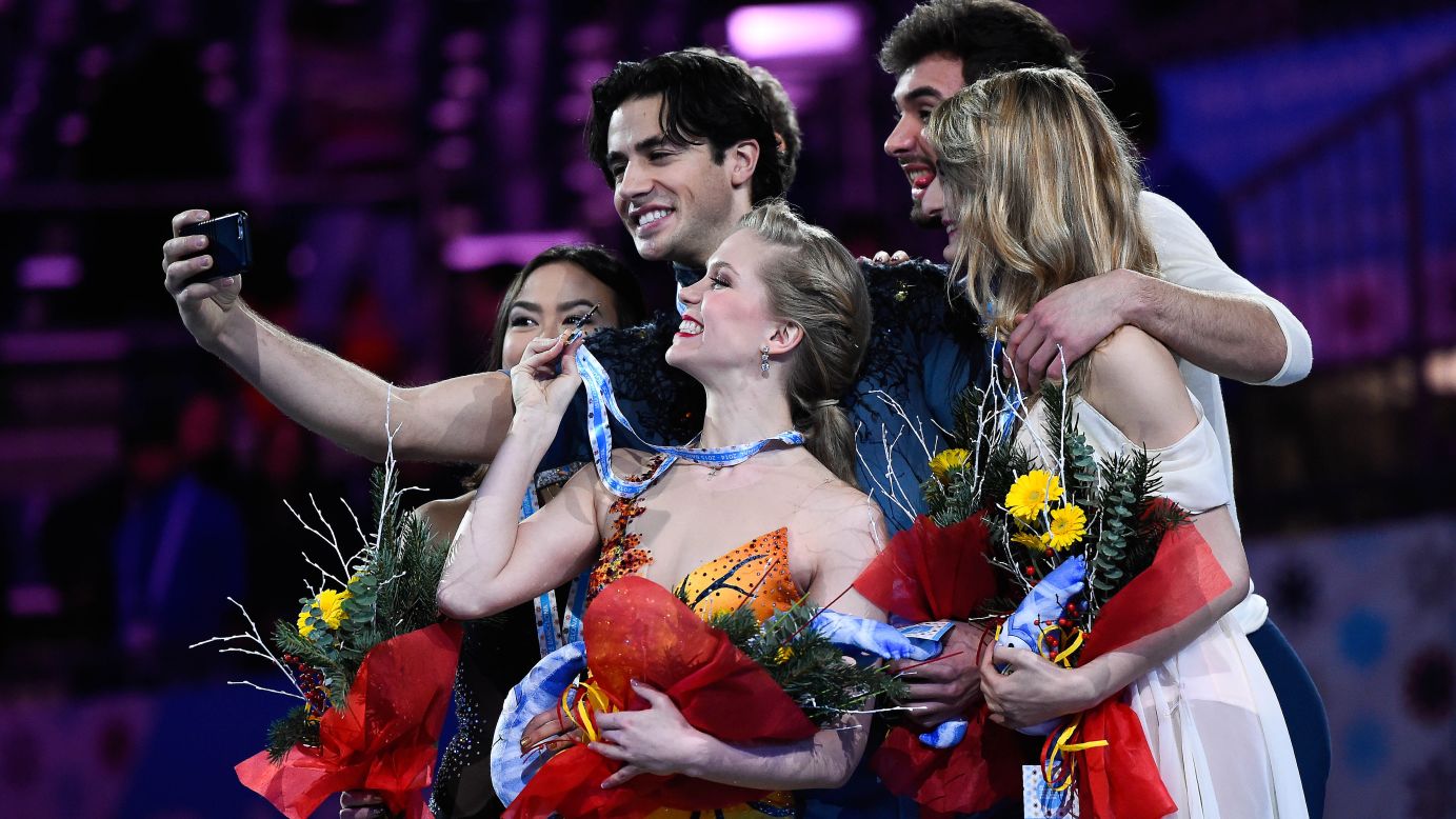 From left, ice dancers Madison Chock, Kaitlyn Weaver, Andrew Poje, Guillaume Cizeron and Gabriella Papadakis take a selfie on the medal stand Saturday, December 13, after competing in the ISU Grand Prix of Figure Skating Final. Canadians Weaver and Poje won gold. Americans Chock and Evan Bates won silver. Cizeron and Papadakis, representing France, won bronze. 