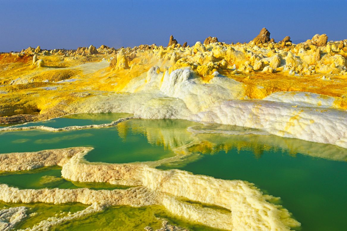 Mother Nature is not afraid to go technicolor for the right effect. These eye-catching landscapes are among the world's most vivid. Some are completely natural, while others have been helped along by humans. It's no easy feat to reach many of these spots, but they're all worth a closer look. <br /><br /><strong>Dallol, Ethiopia </strong><br /><br />The Dallol hydrothermal field is northeast of the Erta Ale Range in one of the lowest and hottest areas of the desolate Danakil Depression in Ethiopia. The Dallol craters are the Earth's lowest known subaerial volcanic vents. Salty hot springs featuring a rich palette of colors dot the area. There are hot yellow sulphur fields among the white salt beds.