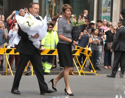 Prime Minister Tony Abbott arrives with his wife Margaret to pay their respects at Martin Place on December 16.