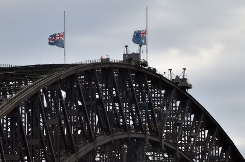 Australian flags fly at half mast on Sydney Harbour Bridge on December 16 following the fatal siege.