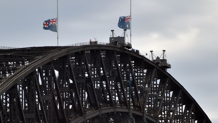 Australian flags fly at half mast on Sydney Harbour Bridge on December 16 following the fatal siege.