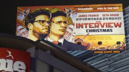 A banner for "The Interview"is posted outside Arclight Cinemas, Wednesday, Dec. 17, 2014, in the Hollywood section of Los Angeles. A U.S. official says North Korea perpetrated the unprecedented act of cyberwarfare against Sony Pictures that exposed tens of thousands of sensitive documents and escalated to threats of terrorist attacks that ultimately drove the studio to cancel all release plans for the film at the heart of the attack, "The Interview." (AP Photo/Damian Dovarganes)