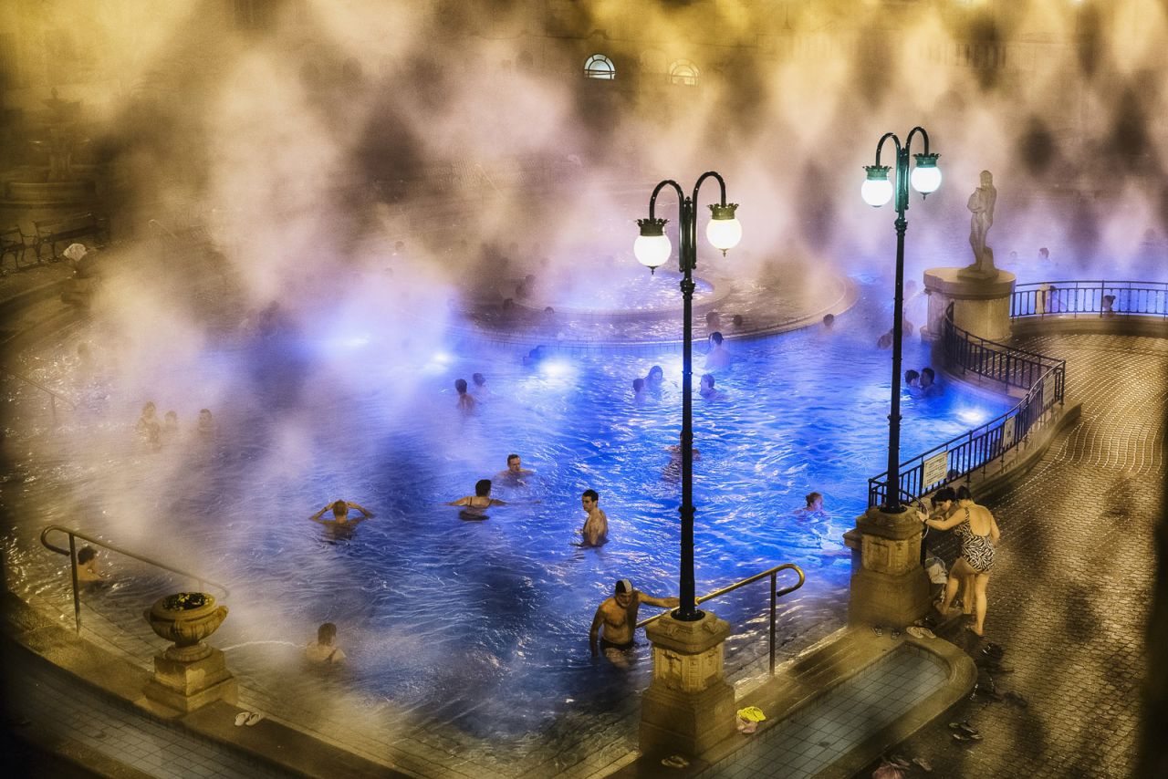 <strong>Places Winner: "Bathing in Budapest"</strong><br /><br />Location: Budapest, Hungary<br /><br />Photo and caption by Triston Yeo/National Geographic 2014 Photo Contest<br /><br />Triston Yeo says: "The thermal spas in Budapest [are] one of the favorite activities of Hungarians, especially in winter. We were fortunate to gain special access to shoot in the thermal spa thanks to our tour guide, Gabor. I love the mist, caused by the great difference in temperature between the hot spa water and the atmosphere. It makes the entire spa experience more surreal and mystical." 