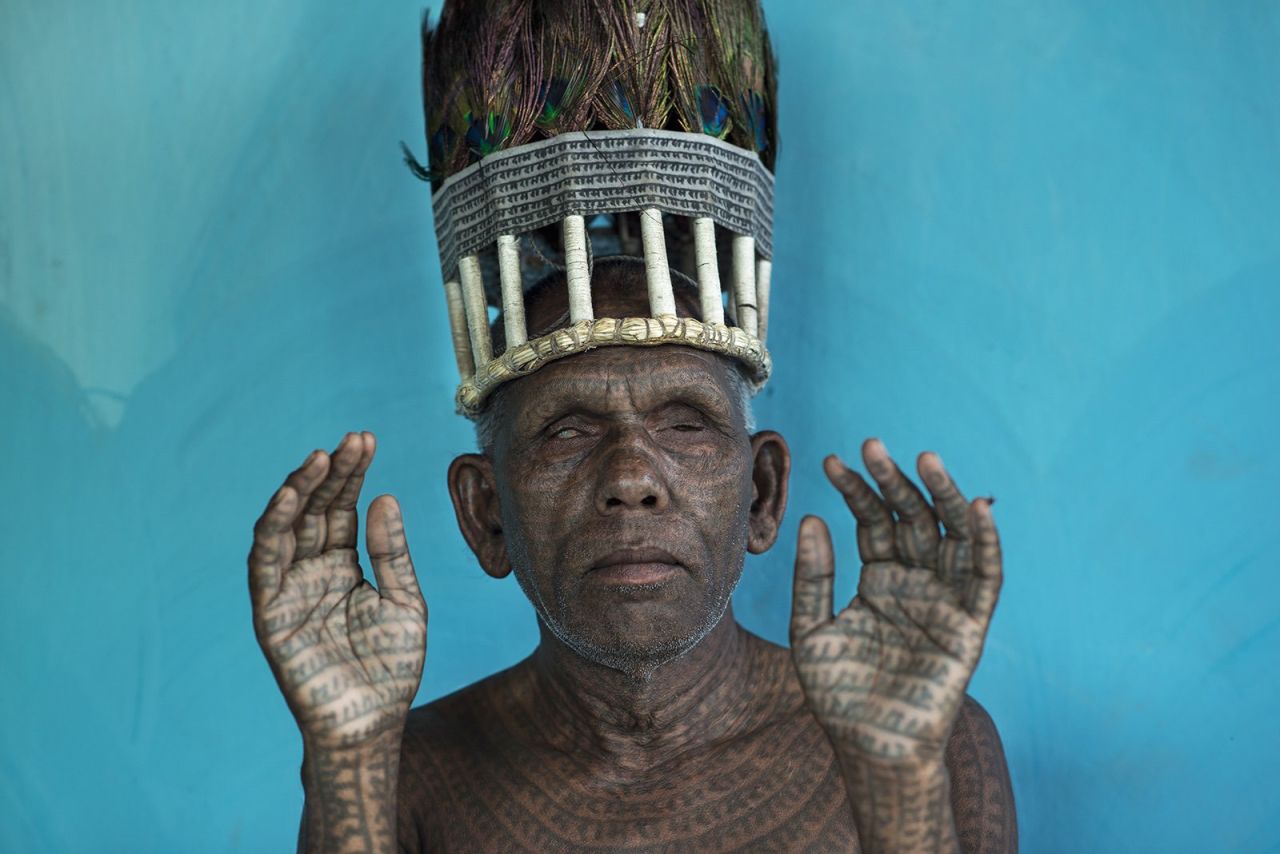 <strong>Honorable Mention People: "Biltigiri"</strong><br /><br />Location: Chhattisgarh, India <br /><br />Photo and caption by Mattia Passarini/National Geographic 2014 Photo Contest<br /><br />Mattia Passarini says: "The chef of Ramnami people in Chhattisgarh, India. Ramnami tattoo the name of the lord 'Ram' on their body. Their entire focus is on the name of Ram, the name of God that is most dear to them. The Ramnami Samaj is a sect of harijan (Untouchable) Ram. Formed in the 1890s, the sect has become a dominant force in the religious life of the area. The tattoo is the result of their devotion and also, a gift and an acknowledgement from Ram."