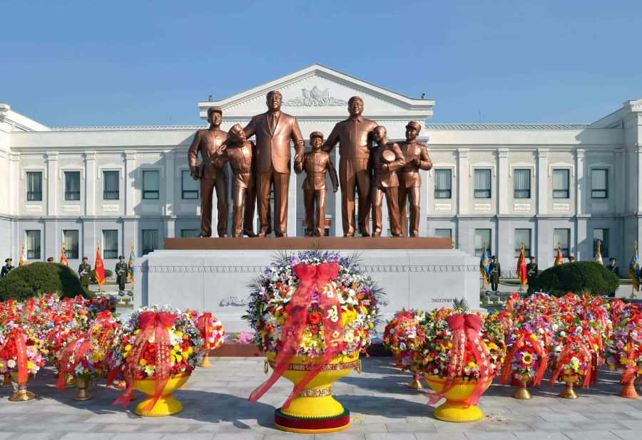 A picture taken by North Korea's official Korean Central News Agency shows the statues of late leaders Kim Il Sung (third left) and Kim Jong Il (third right) at Mangyongdae Revolutionary School in Pyongyang on February 16, 2013. Photographers who have spent time in the country say that particular care must be taken when snapping pictures of statues of North Korean leaders.