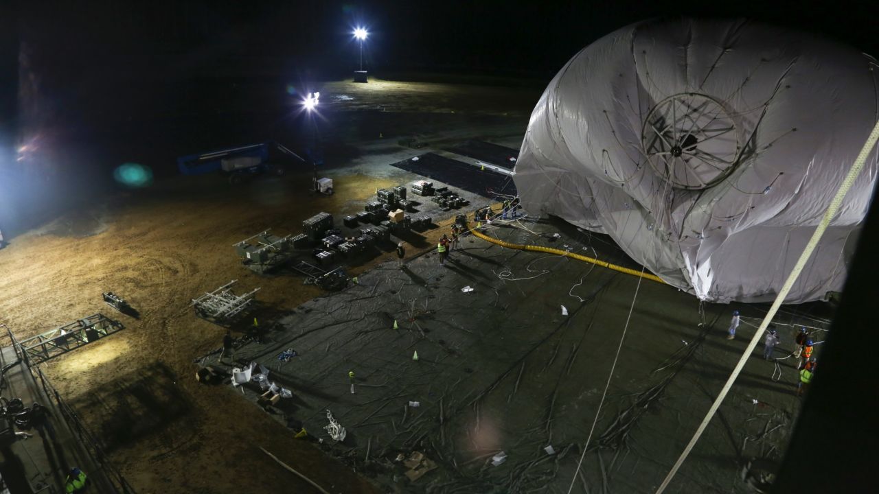 The U.S. Army is launching two stationary "blimps" at 10,000-feet over Maryland to better protect the Washington, D.C., area from cruise missiles and other possible air attacks. On December 14, personnel from the Joint Land Attack Cruise Missile Defense Elevated Netted Sensor System (JLENS) oversee the inflation of an aerostat, or stationary blimp, at Aberdeen Proving Ground, Maryland.