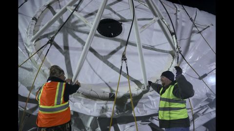 Crew work with the structure of the aerostat at Aberdeen Proving Ground, Maryland.