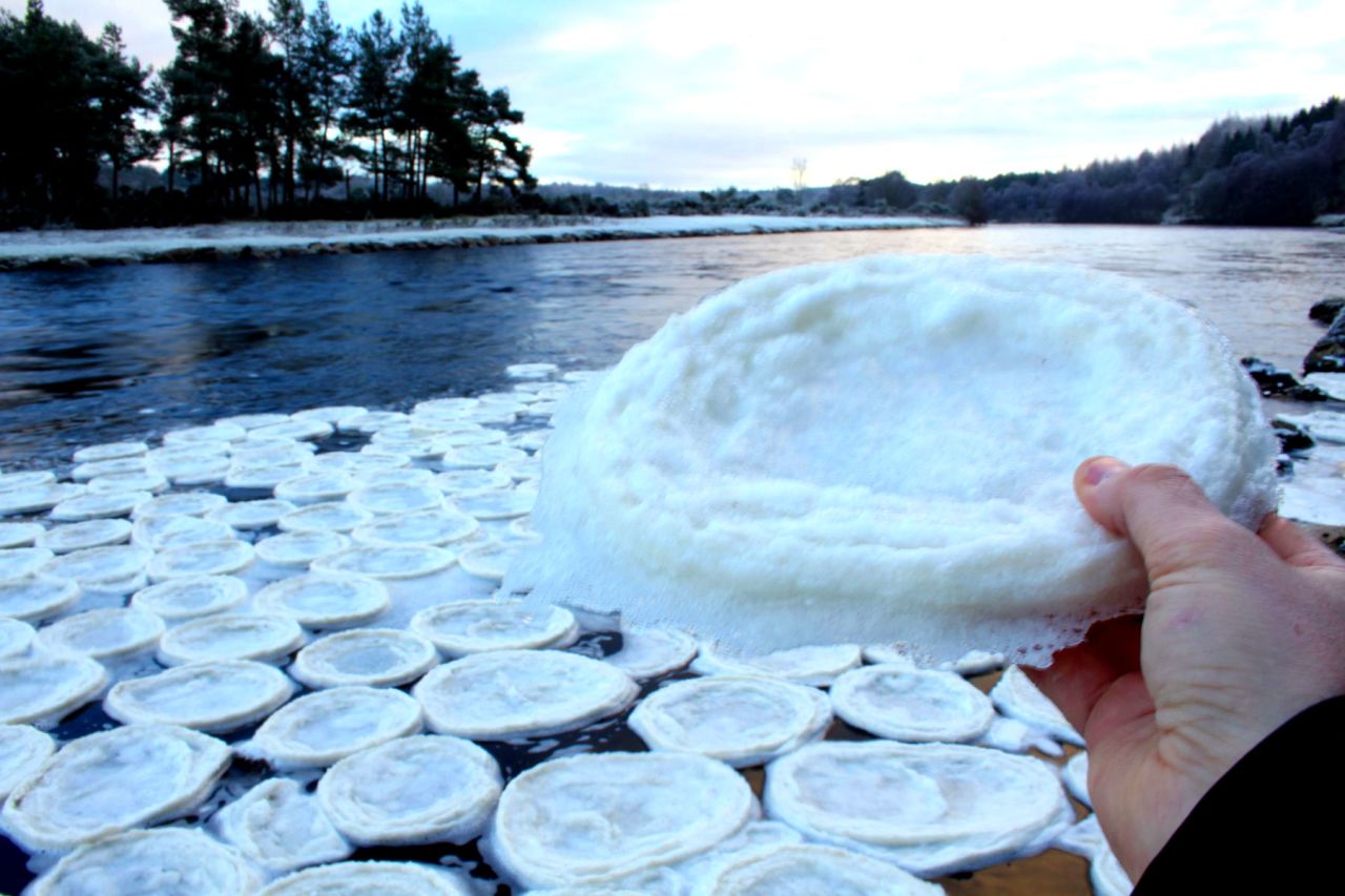 The theory is that the pancakes were formed when foam spinning in river eddies became frozen and was later softened in fluctuating temperatures.