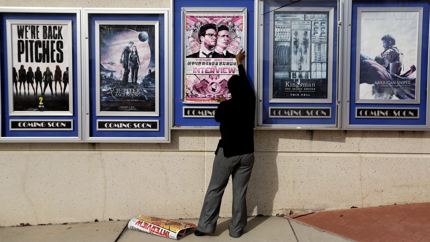 A poster for the movie "The Interview" is taken down from a theater in Atlanta on Wednesday, December 17. Sony Pictures <a href="http://money.cnn.com/2014/12/17/media/the-interview-sony-theater-owners/index.html" target="_blank">canceled its plans to release the comedy</a> -- which depicts an assassination plot against North Korean leader Kim Jong Un -- following a threat from a group that hacked the movie studio. FBI investigators tracked the hackers back to the North Korean regime, U.S. law enforcement officials said.