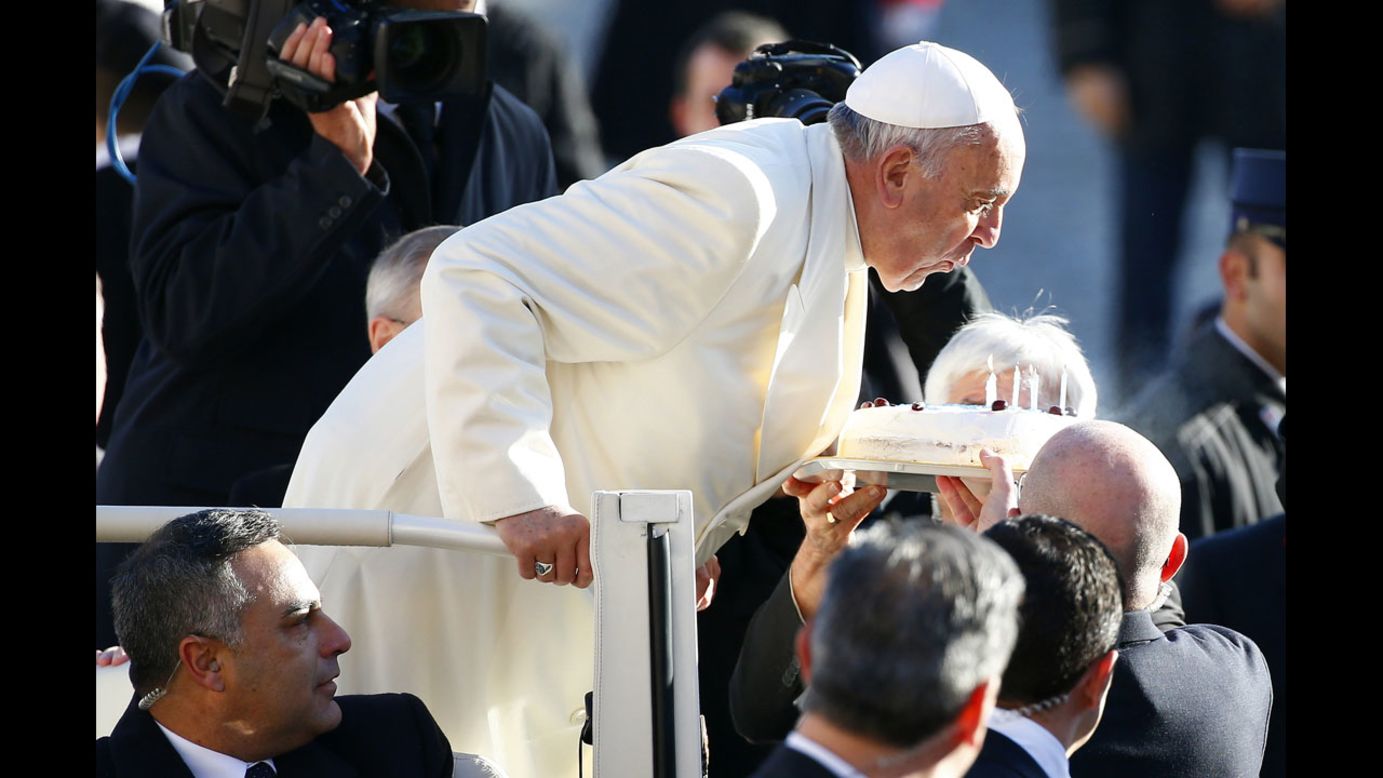 Pope Francis blows out candles as he celebrated his 78th birthday at the Vatican on Wednesday, December 17.