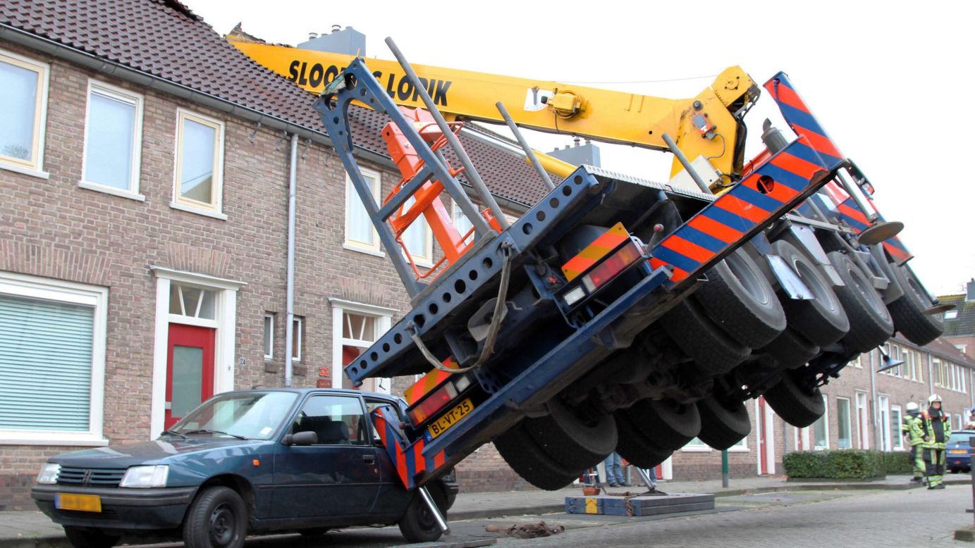 A crane fell on the roof of a house in Ijesselstein, Netherlands, on Saturday, December 13. No one was hurt in the incident, which happened when a man <a href="http://www.cnn.com/2014/12/13/living/feat-crane-marriage-proposal-netherlands/" target="_blank">tried to surprise his girlfriend</a> by proposing from the top of the crane, according to Dutch affiliate RTL News.