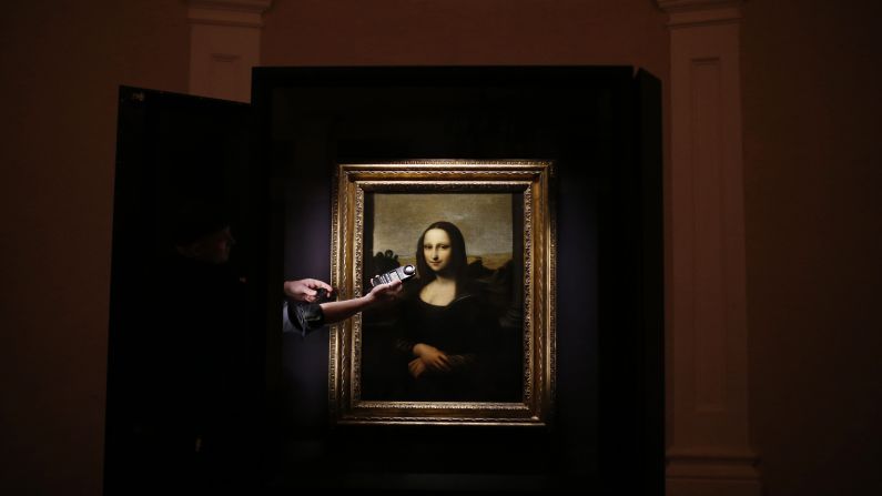 A museum staff member checks the lighting near the "Earlier Mona Lisa" before the painting went on exhibition at The Arts House in Singapore. A private Swiss art foundation <a href="http://www.cnn.com/2012/09/28/world/europe/switzerland-different-mona-lisa/index.html" target="_blank">says the painting was done by Leonardo da Vinci</a> years before his "Mona Lisa" masterpiece.